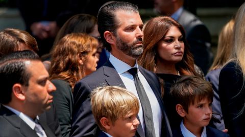 Donald Trump Jr. watches as his mother's casket is carried into a church on Wednesday.