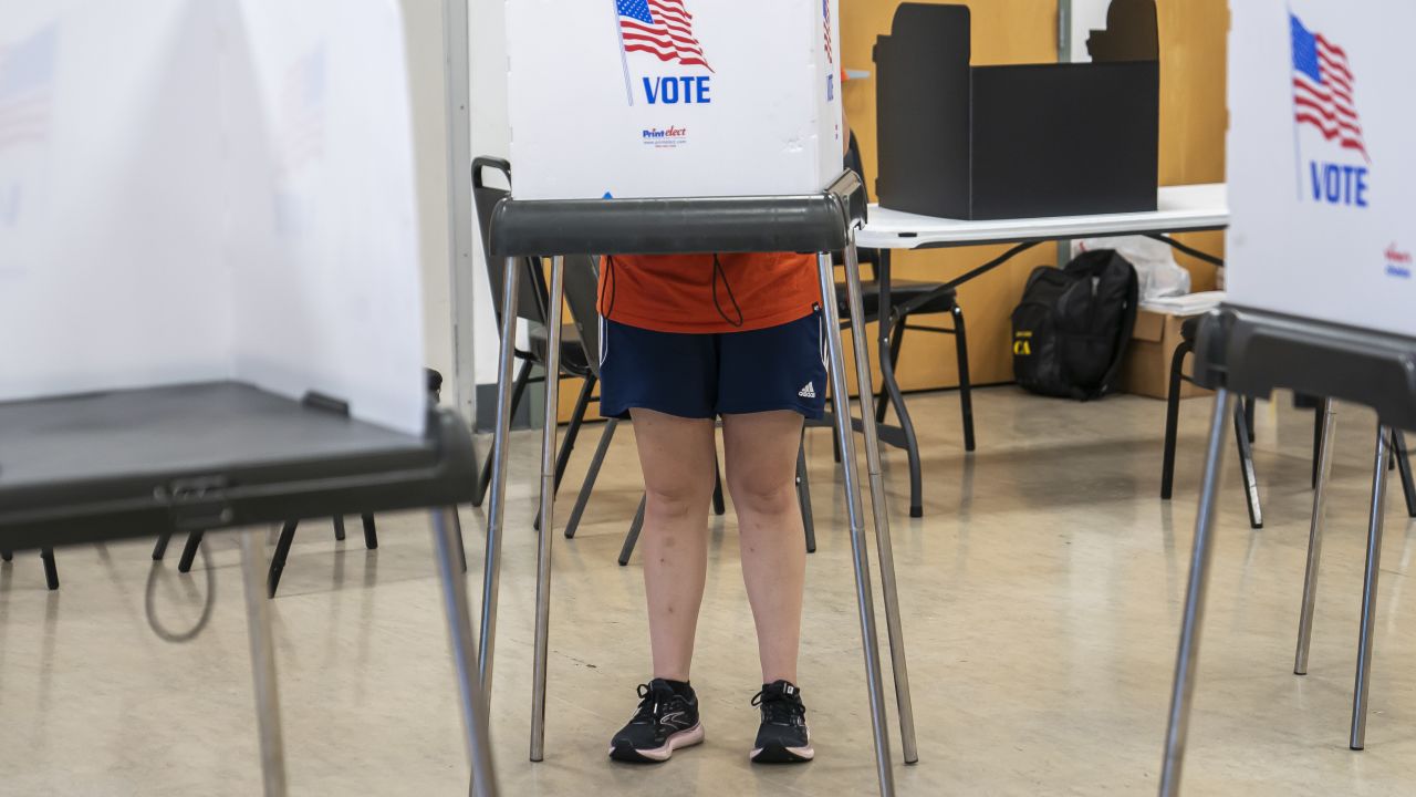 A voter casts their ballot at a polling place at The League for People with Disabilities during the midterm primary election on July 19, 2022 in Baltimore.