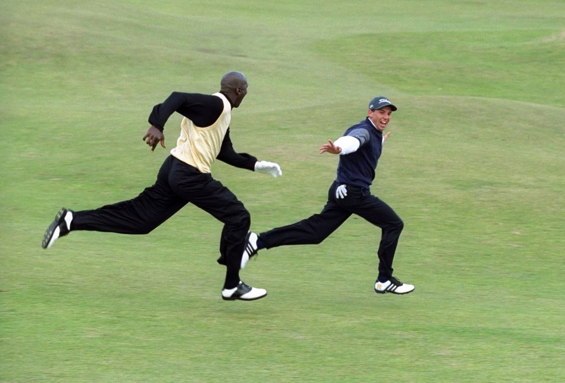 Garcia leads Jordan in a sprint down the 16th fairway of the St. Andrews Old Course during the Alfred Dunhill Cup Pro-Am, 1999.