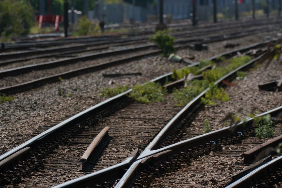 Train tracks painted white to help with the heat at Alexandra Palace train station in London. 