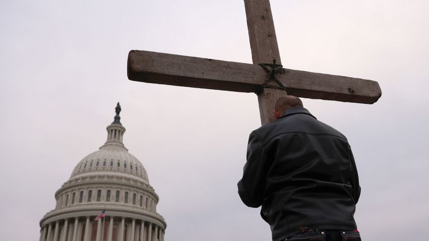 WASHINGTON, DC - JANUARY 6: Supporters of US President Donald Trump pray outside the US Capitol on January 6, 2021 in Washington, DC. Congress will meet today in joint session to approve President-elect Joe Biden's 306-232 electoral vote over President Donald Trump. A group of Republican senators said they would reject several states' Electoral College votes unless Congress appoints a committee to audit the results.  (Photo by Win McNamee/Getty Images)