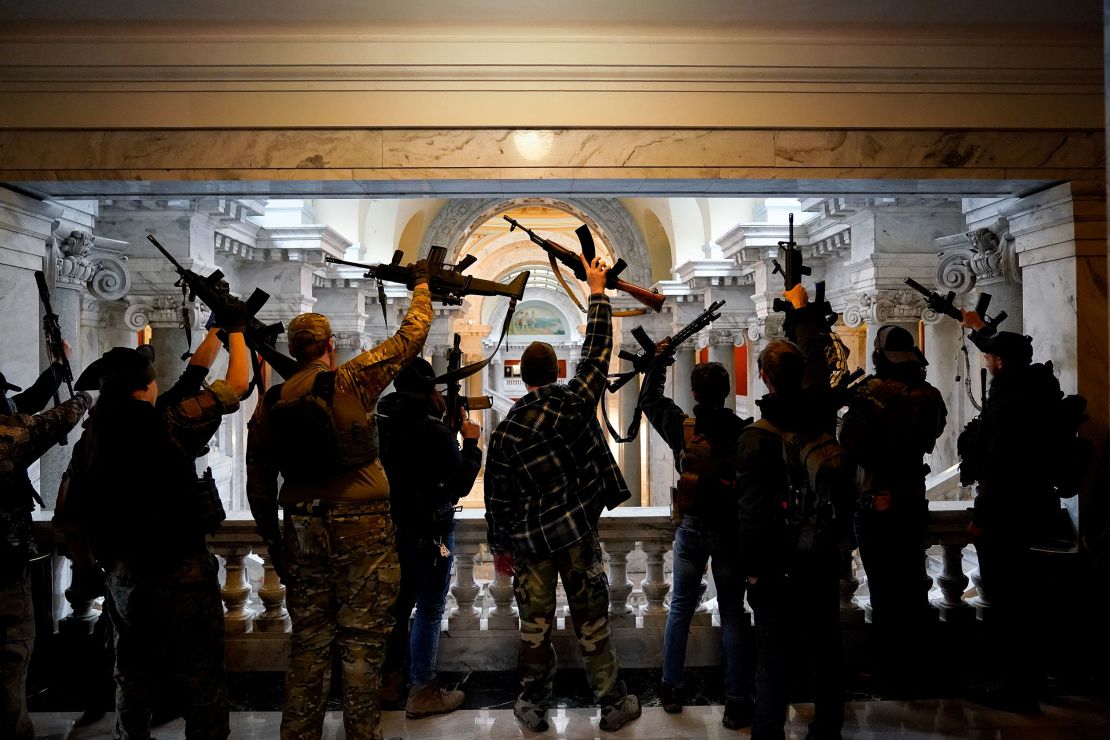 Gun rights activists carrying semi-automatic firearms pose for a photograph in the state Capitol Building on January 31, 2020, in Frankfort, Kentucky. 