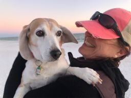 Melanie Kaplan and beagle Alexander "Hammy" Hamilton in Santa Rosa Beach, Florida.