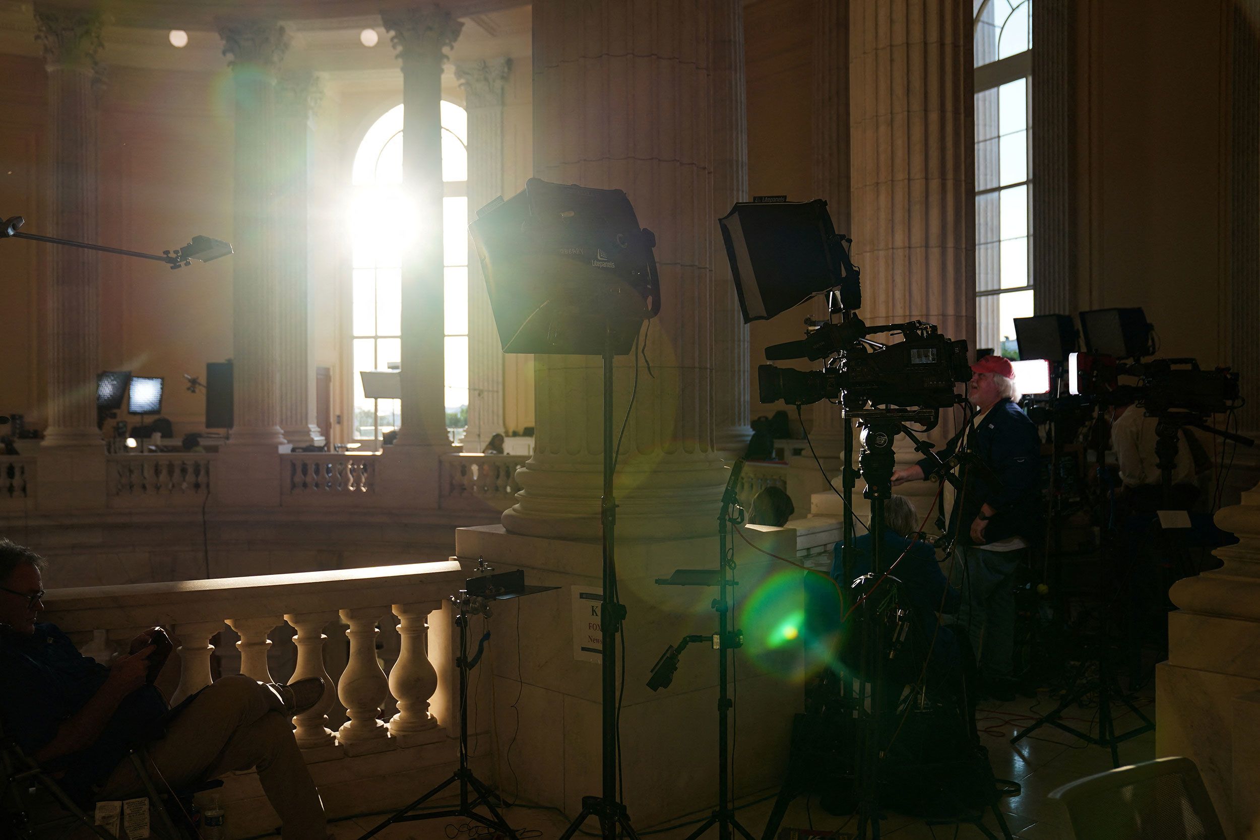 Members of the press prepare to cover the July 21 hearing.