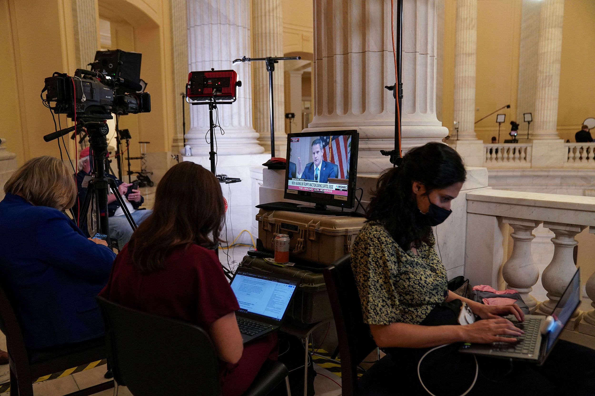 Members of the press cover the hearing on July 21.