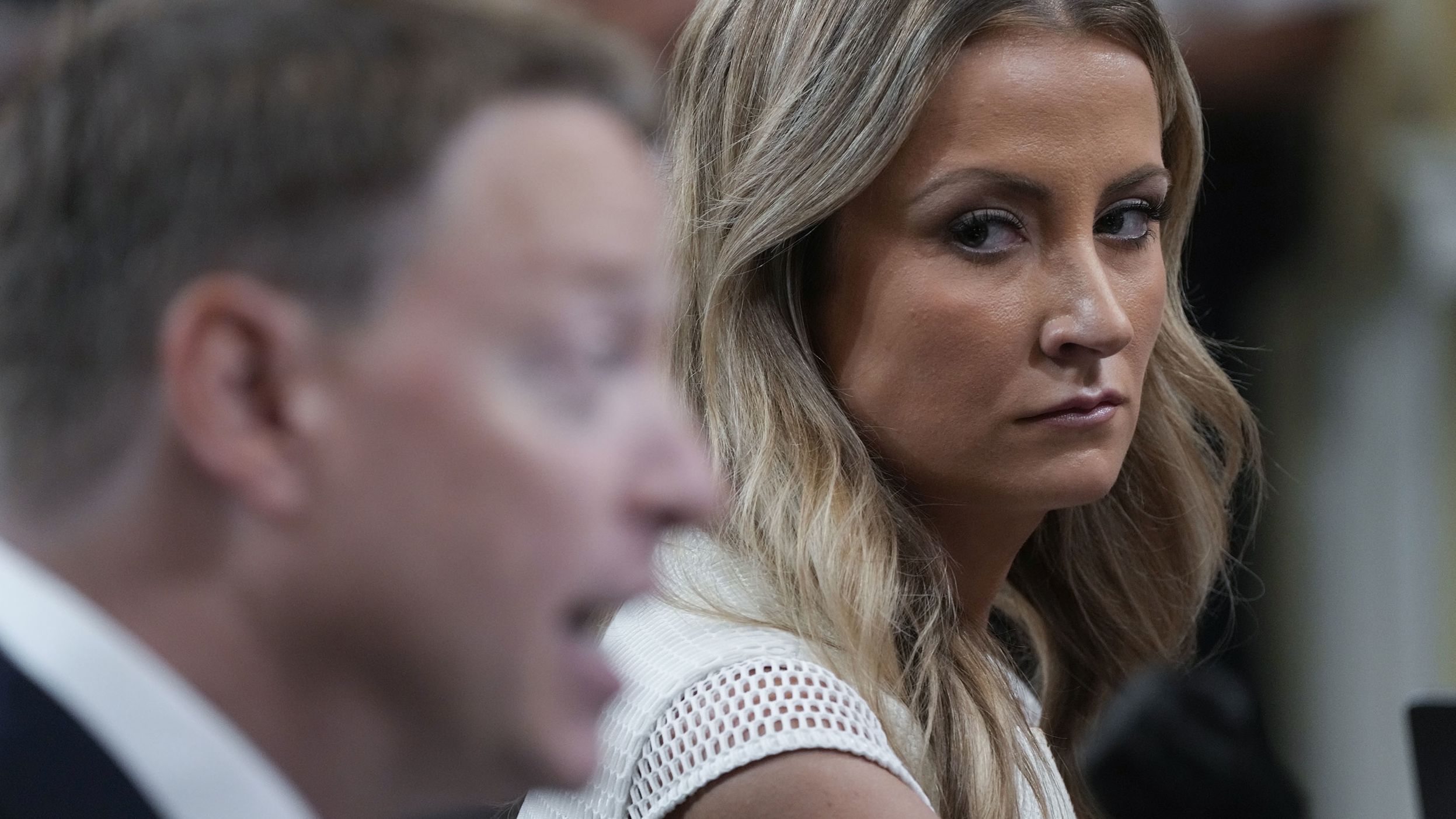 Former White House deputy press secretary Sarah Matthews watches as former deputy national security adviser Matt Pottinger testifies during the July 21 hearing. Pottinger served on Trump's National Security Council before resigning in the immediate aftermath of the January 6 attack. <a href="index.php?page=&url=https%3A%2F%2Fwww.cnn.com%2Fpolitics%2Flive-news%2Fjanuary-6-hearings-july-21%2Fh_9676c86c81e96d41349dbba7e7312644" target="_blank">In his testimony,</a> he said that Trump's tweet calling Vice President Mike Pence a "coward" essentially was "fuel being poured on the fire" the day of the insurrection. "I was disturbed and worried to see that the President was attacking Vice President Pence for doing his constitutional duty," Pottinger said.