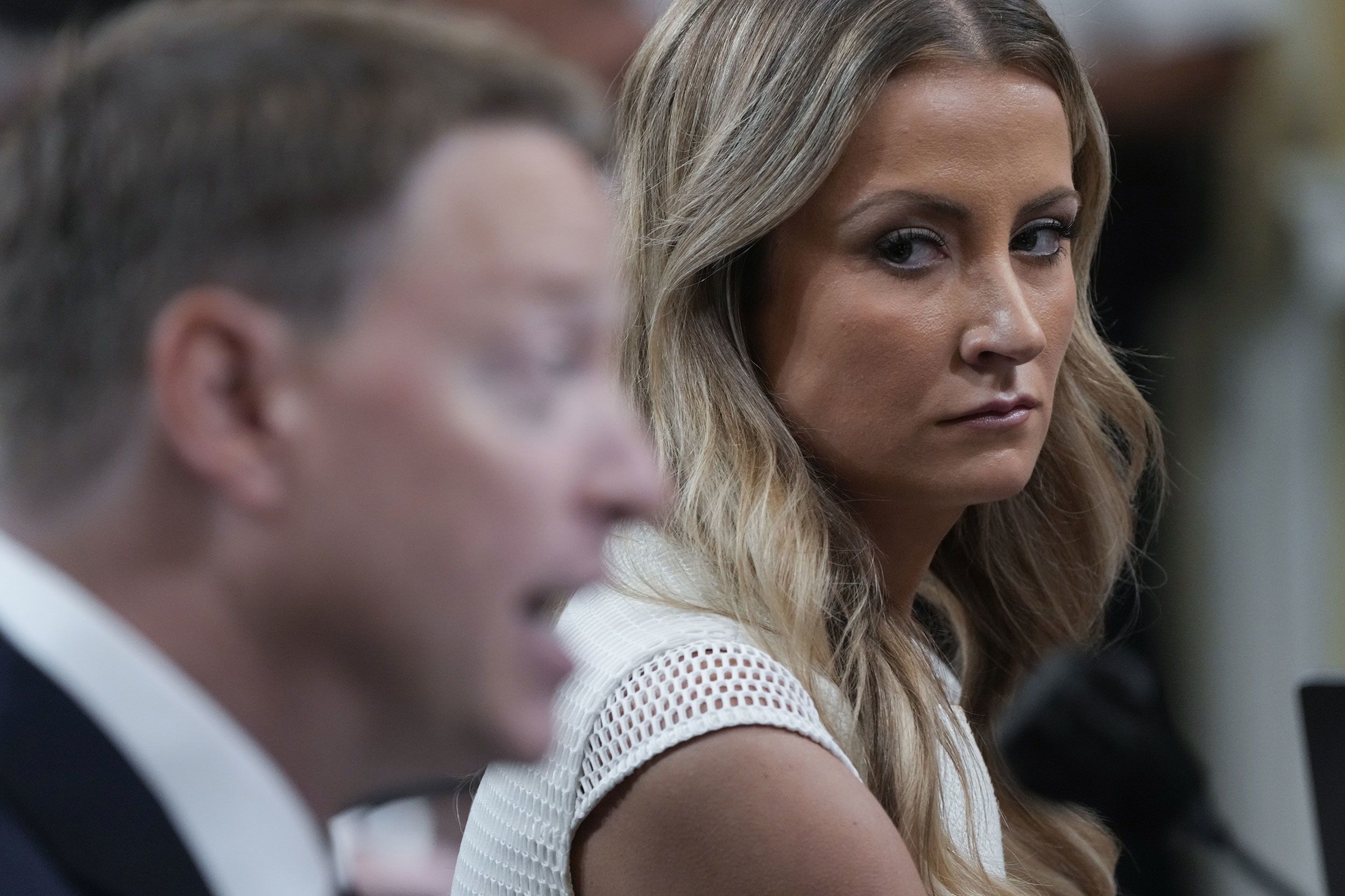 Former White House deputy press secretary Sarah Matthews watches as former deputy national security adviser Matt Pottinger testifies during the July 21 hearing. Pottinger served on Trump's National Security Council before resigning in the immediate aftermath of the January 6 attack. <a href="index.php?page=&url=https%3A%2F%2Fwww.cnn.com%2Fpolitics%2Flive-news%2Fjanuary-6-hearings-july-21%2Fh_9676c86c81e96d41349dbba7e7312644" target="_blank">In his testimony,</a> he said that Trump's tweet calling Vice President Mike Pence a "coward" essentially was "fuel being poured on the fire" the day of the insurrection. "I was disturbed and worried to see that the President was attacking Vice President Pence for doing his constitutional duty," Pottinger said.