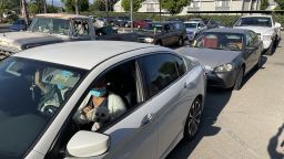A long line of cars at a food distribution center in Riverside, California, in July. (CNN)