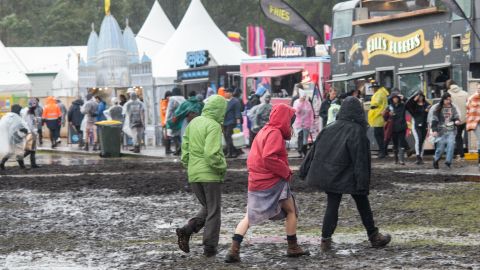 Festivalgoers are seen in the mud at Splendour in the Grass 2022 on July 22, 2022 in Byron Bay, Australia