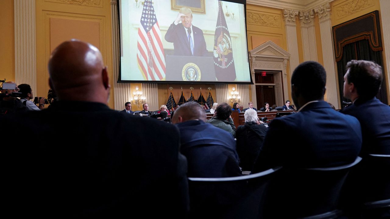 Previously unseen footage of then-President Trump rehearsing a video message is shown over the committee during its public hearing on July 21. <a href="https://www.cnn.com/politics/live-news/january-6-hearings-july-21/h_742b695f5e6532ac2d04a7323a4c6955" target="_blank">During outtakes of the message,</a> recorded on January 7, 2021, Trump struggled to condemn the violence at the US Capitol and refused to say "the election is over."