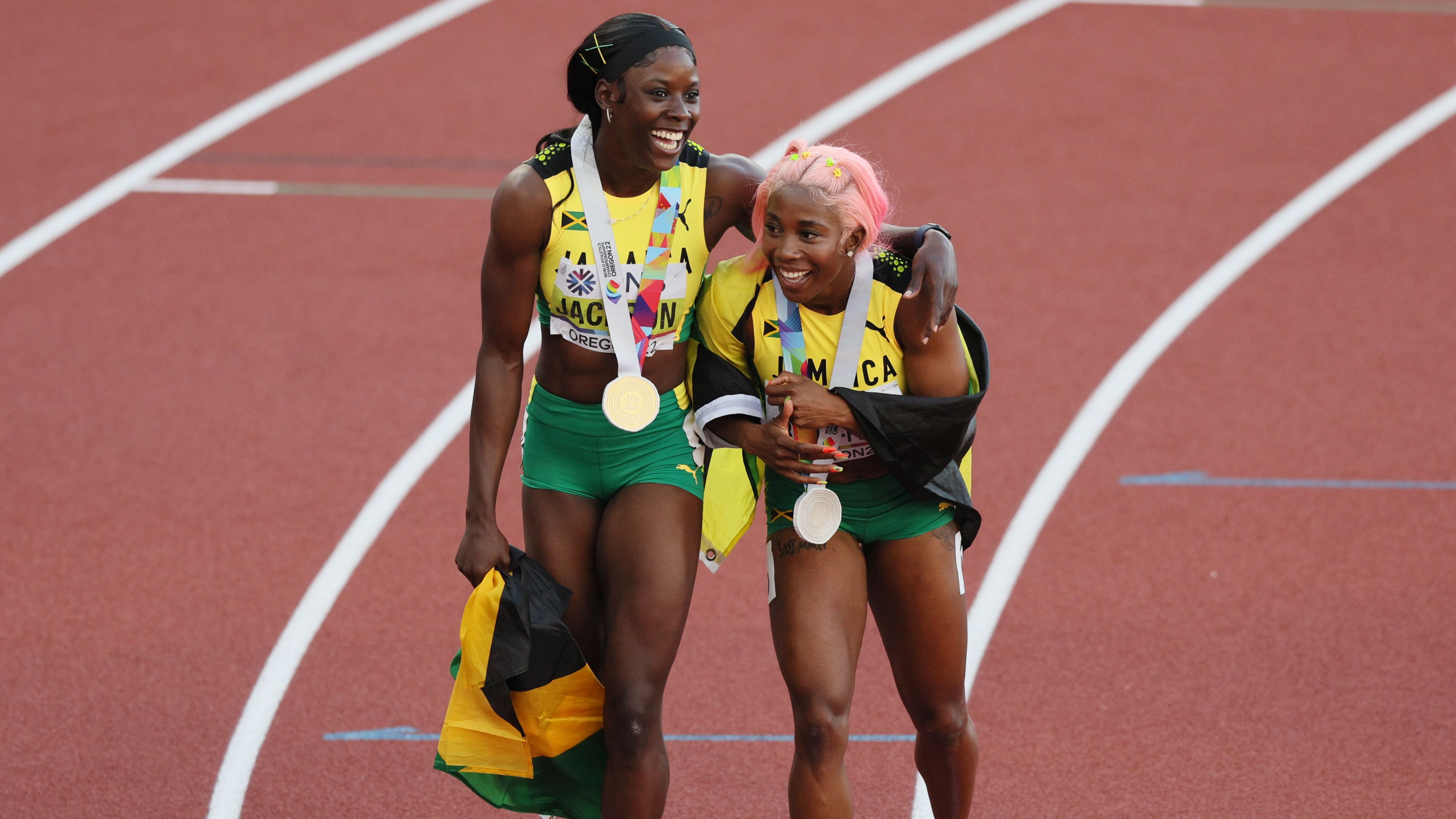 Gold medalist Shericka Jackson and silver medalist Shelly-Ann Fraser-Pryce celebrate after the women's 200m in Oregon, US. 