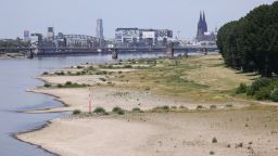 Banks and the low water in the river Rhine seen during a heat wave on July 18, 2022 in Cologne, Germany. The Rhine level is currently very low and measured 118 centimeters depth this afternoon by the city of Cologne. 