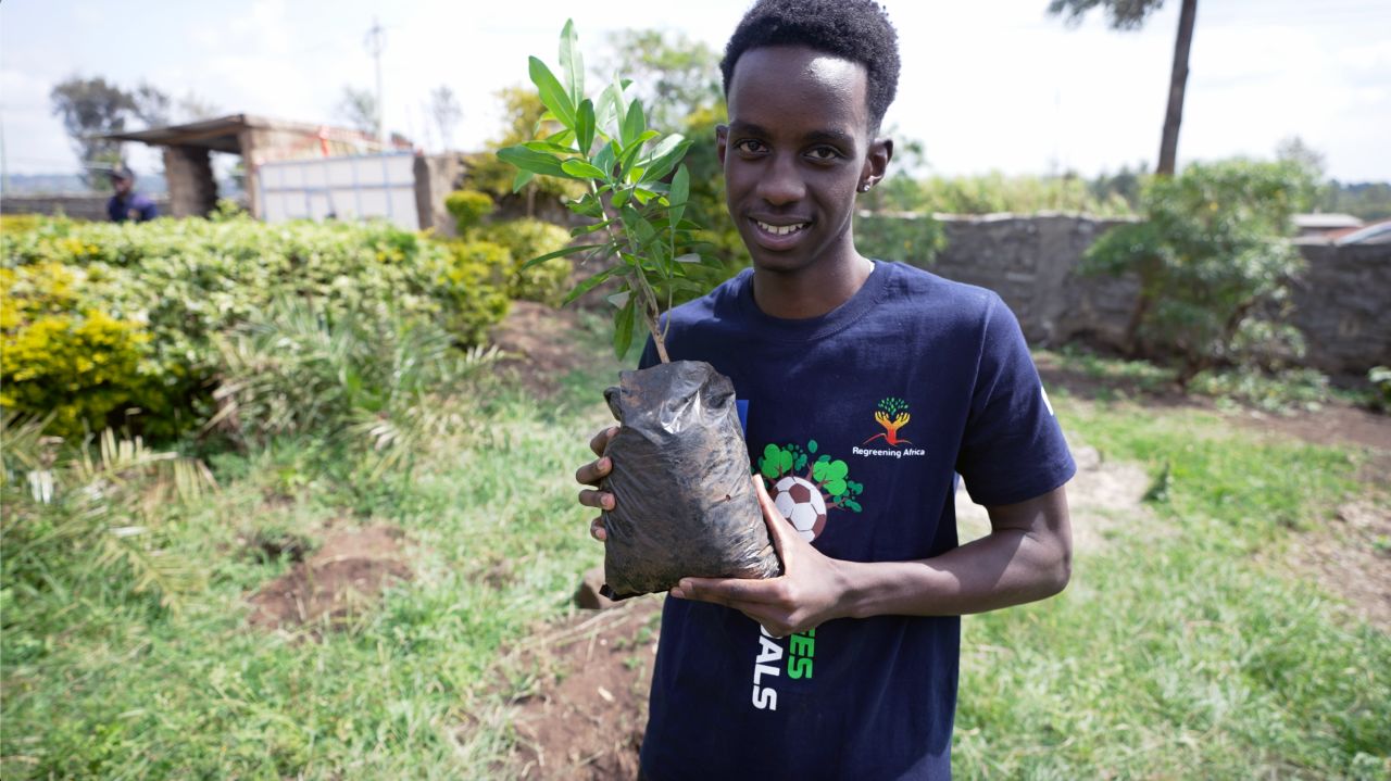 Lesein Mutunkei, an 18-year-old from Kenya, started Trees4Goals in his home country in 2018. For every goal he scores on the football pitch, he plants 11 trees -- and helps others do the same. Here, he's pictured holding a sapling that will be used for a tree planting session with a local school. <strong>Look through the gallery for more athletes using their platform to draw awareness to the climate crisis.</strong>