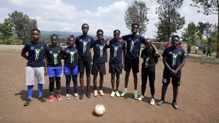Mutunkei stands with his Trees4Goals campaign team