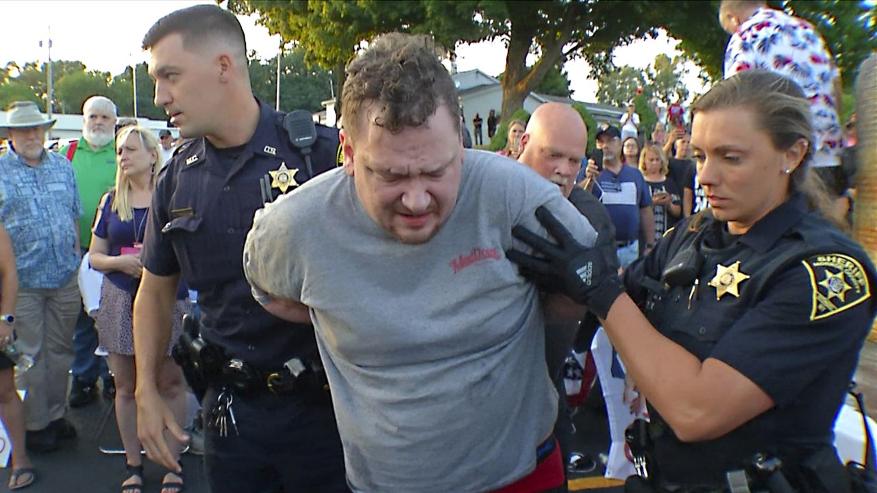 David Jakubonis, center, is taken into custody by Monroe County Sheriff deputies after he allegedly brandished a sharp object during an attack on Rep. Lee Zeldin on Thursday, July 21, 2022.