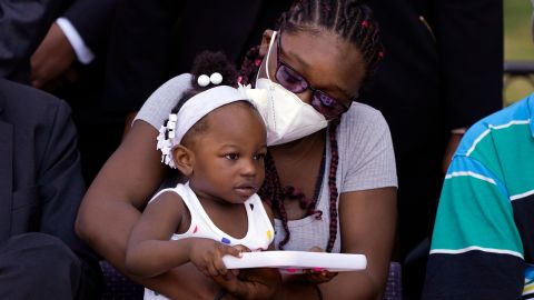 Starmanie Jackson holds her child, Gabriella, during a news conference on July 12, 2022, in Detroit.