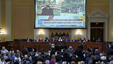 A video of Fox News on January 6, 2021, is displayed on a screen as the House select committee investigating the attack on the US Capitol holds a hearing in Washington on July 21, 2022.