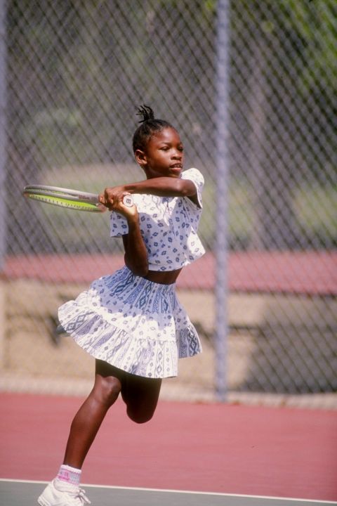 Serena plays tennis in 1992. She and her sister spent their early years playing tennis in Compton, California, just outside of Los Angeles. They later moved to a tennis academy in Florida.
