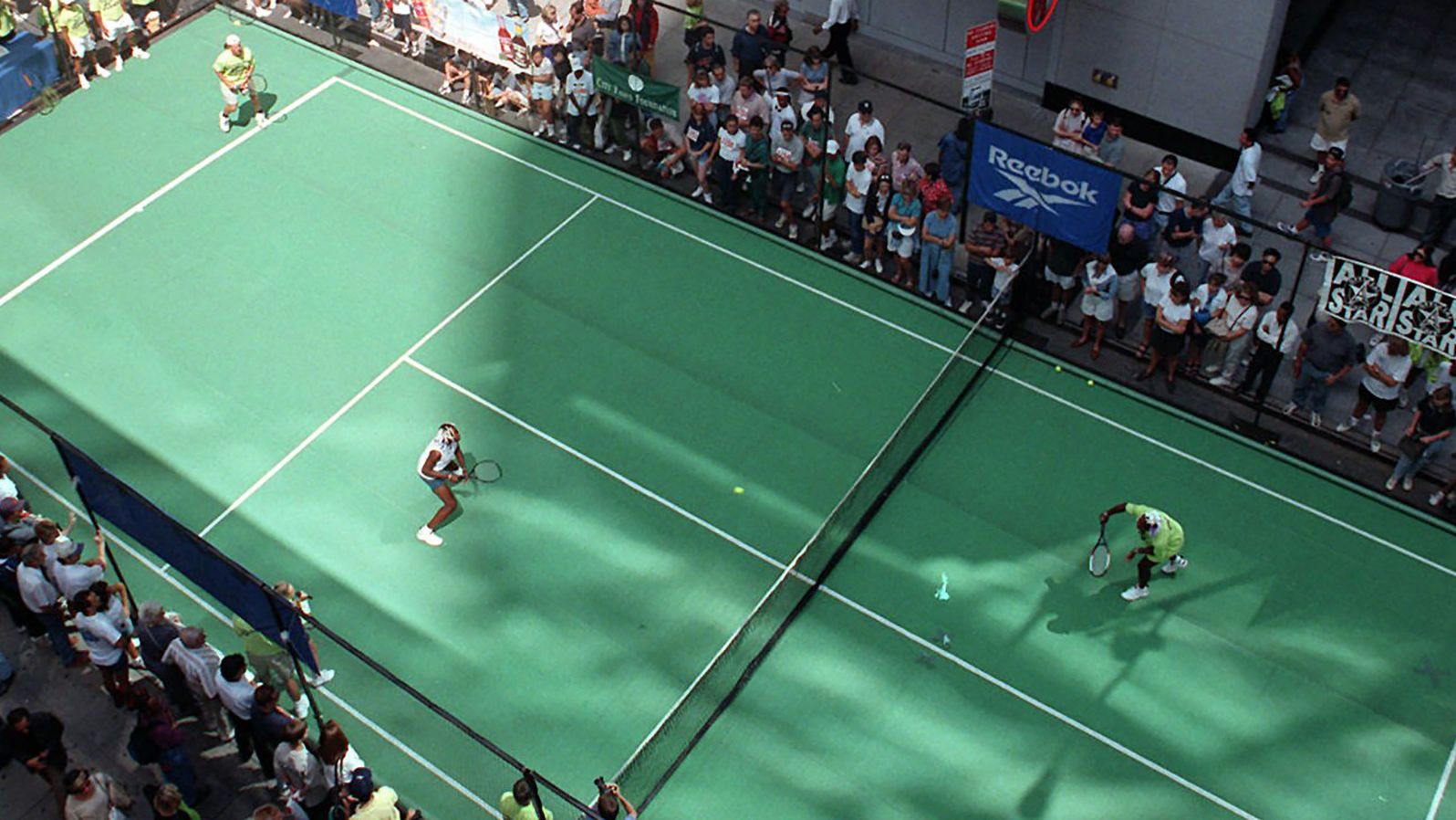 The Williams sisters and the Jensen brothers, Luke and Murphy, play an exhibition in New York's Times Square in 1997. It was part of the lead-up to the US Open.