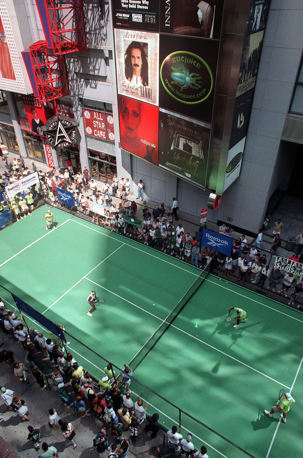The Williams sisters and the Jensen brothers, Luke and Murphy, play an exhibition in New York's Times Square in 1997. It was part of the lead-up to the US Open.