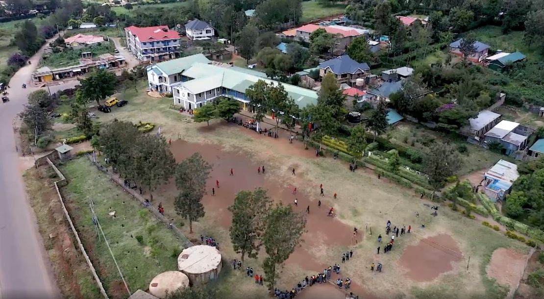 Mutunkei and his team play a football match at a school.