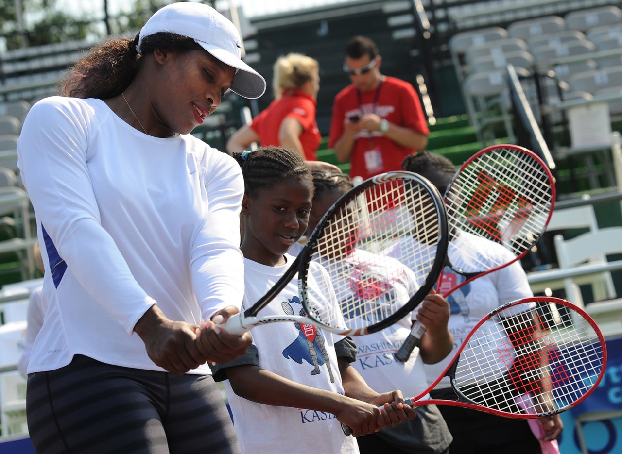 Williams demonstrates a proper backhand during a clinic held in Washington, DC, in 2011. That year, she underwent emergency treatment for a hematoma related to a pulmonary embolism, a blood clot in her lungs.
