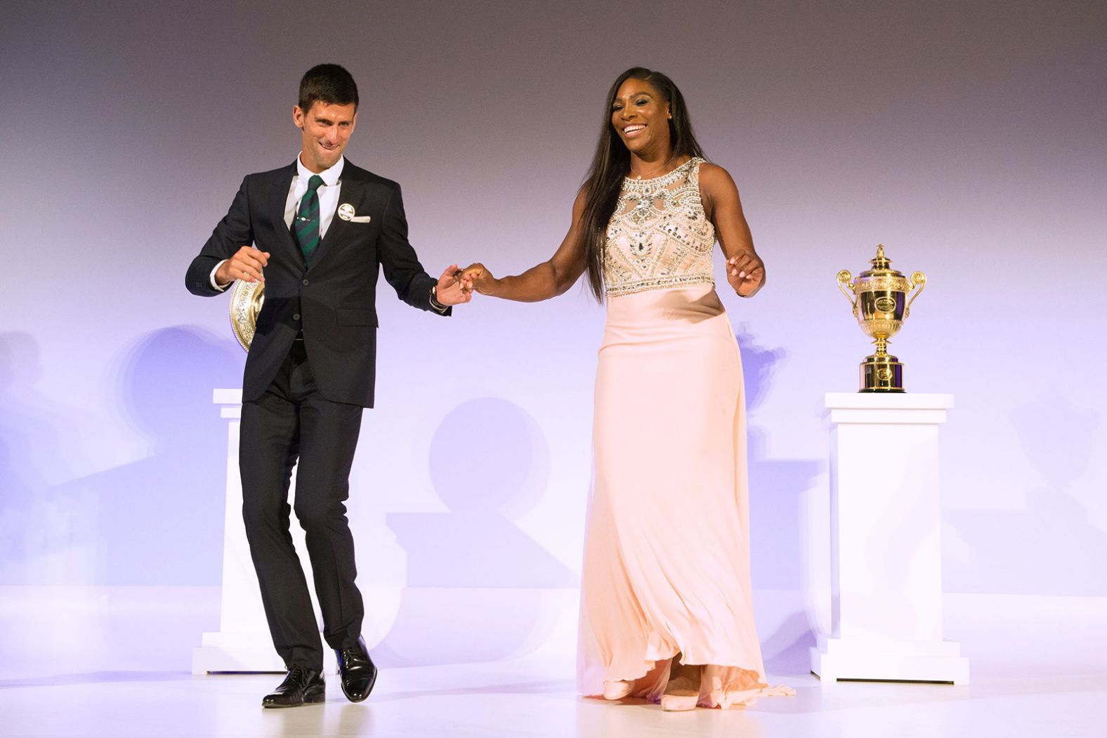 Williams dances with men's champion Novak Djokovic at the Wimbledon champions dinner in 2015.