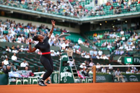 Williams serves during a French Open match in 2018. A controversy erupted at the tournament when Williams wore a catsuit in her first grand slam match since becoming a mother. Shortly after the tournament, the French Tennis Federation instituted a dress code that critics denounced as racist and sexist.