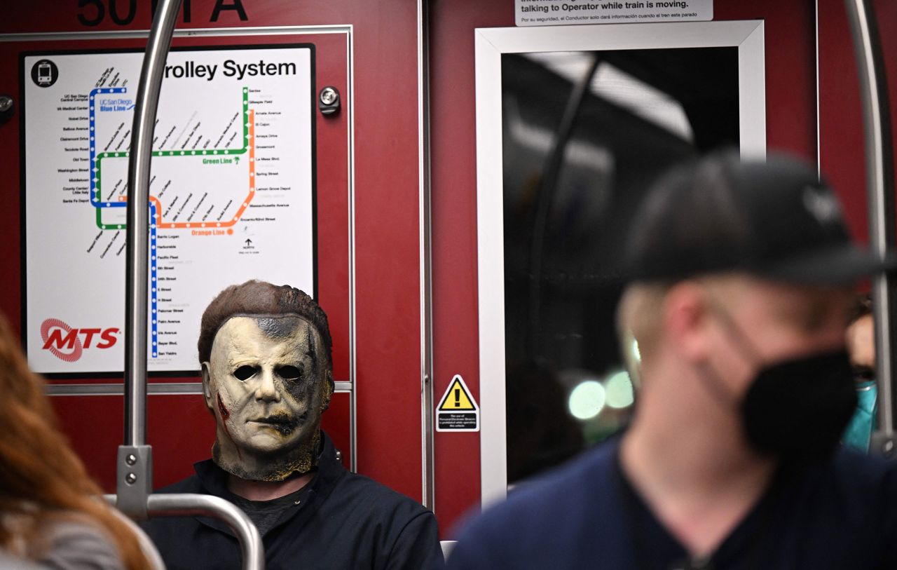 A cosplayer dressed as Michael Myers from the "Halloween" movies rides the trolley on July 21.
