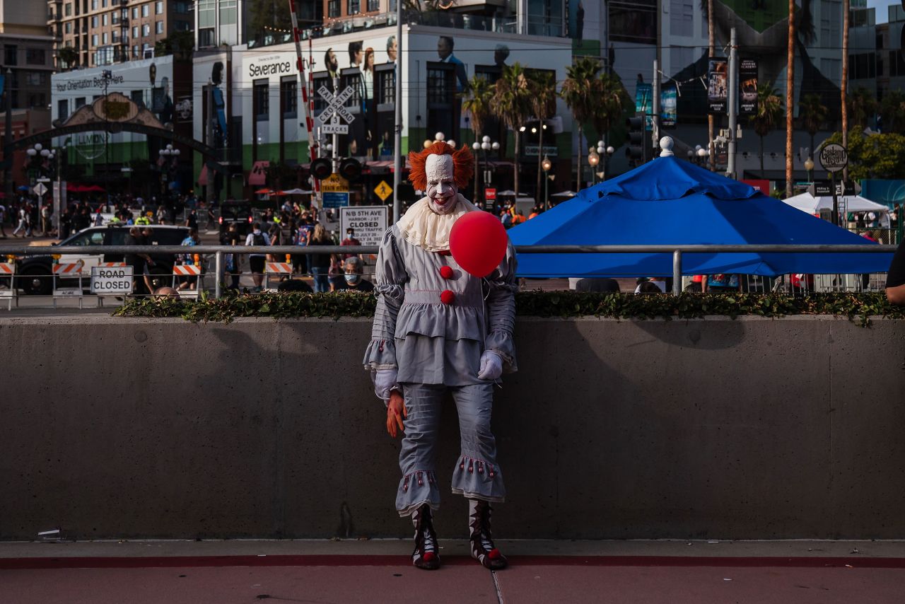 A man dressed as Pennywise, the clown from the film "It," stands near the San Diego Convention Center on July 21.