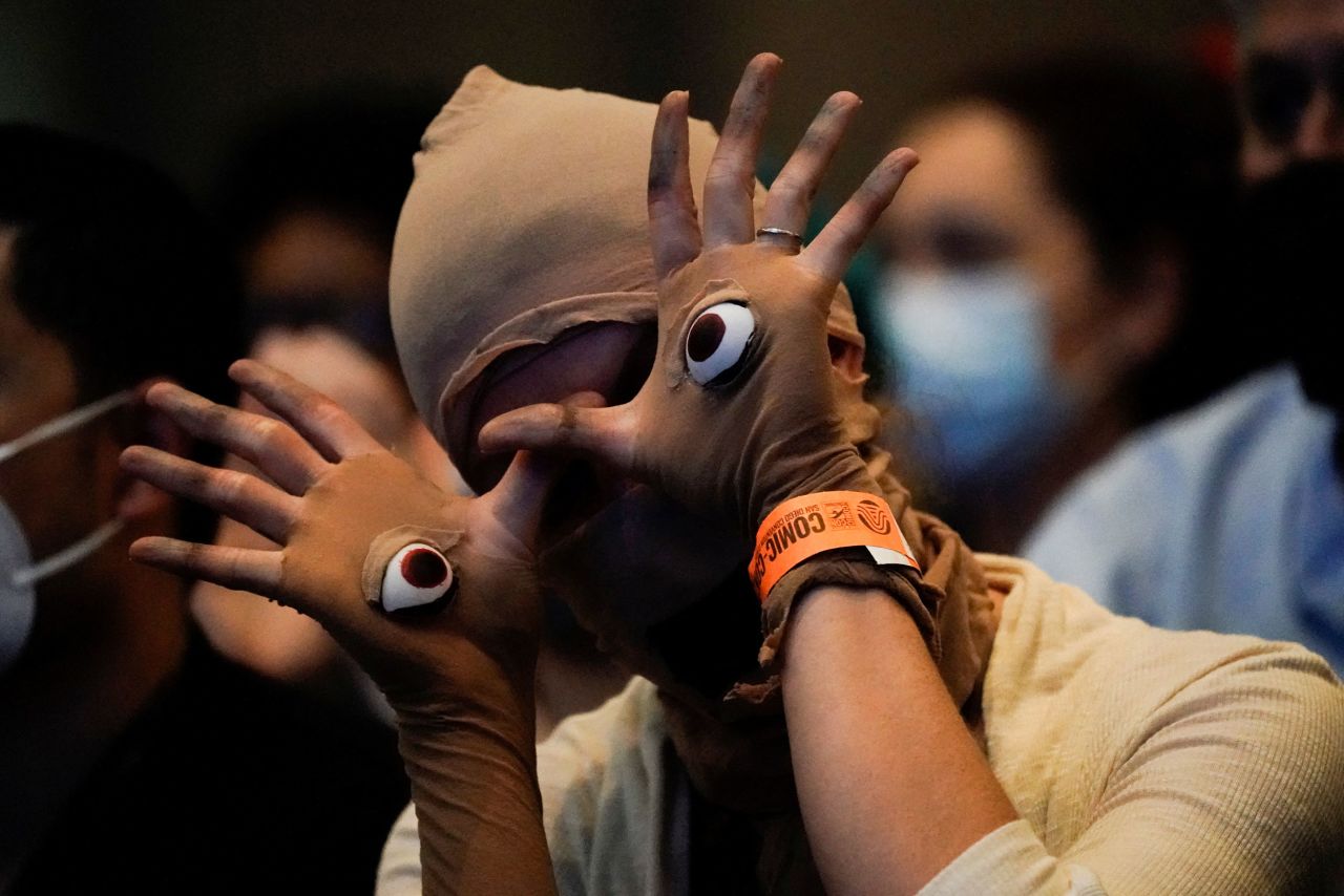 An attendee gestures July 21 while cosplaying as the Pale Man from the film "Pan's Labyrinth."