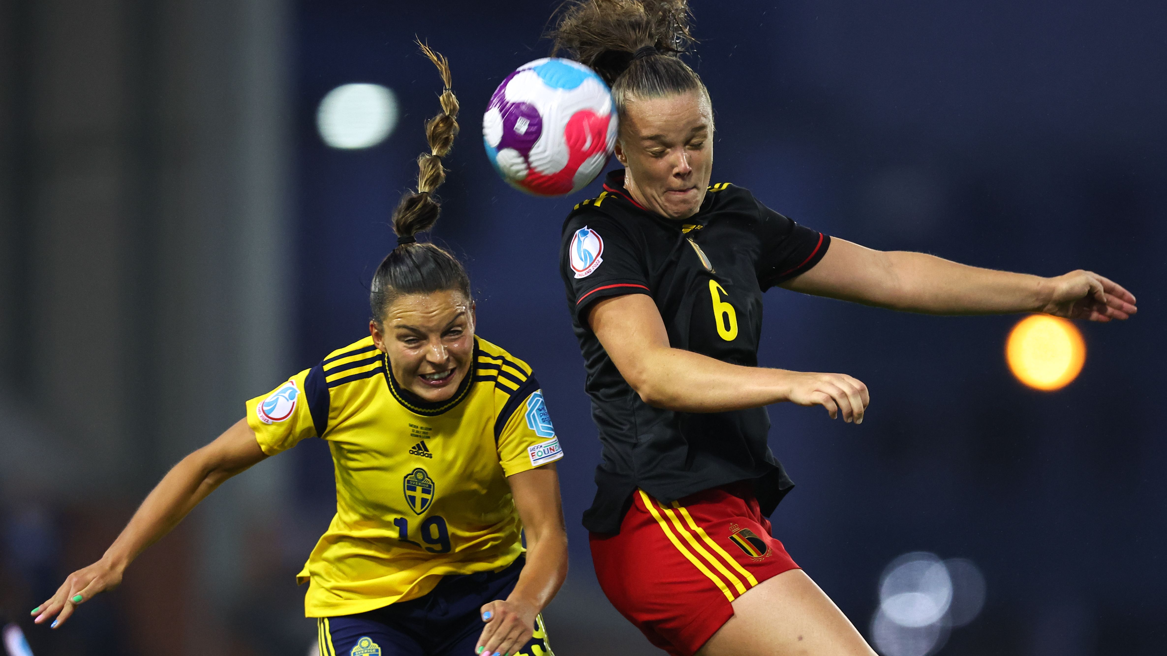 Sweden's Johanna Rytting Kaneryd (left) challenges for a header with Tine De Caigny of Belgium (right).