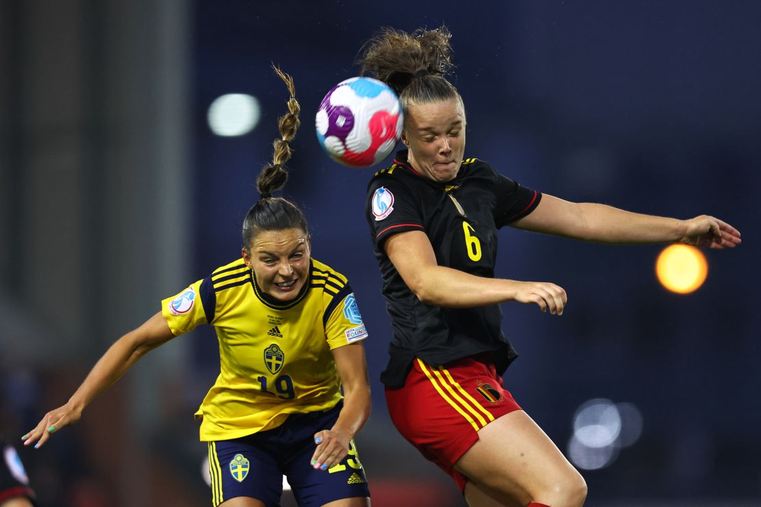 Sweden's Johanna Rytting Kaneryd (left) challenges for a header with Tine De Caigny of Belgium (right).