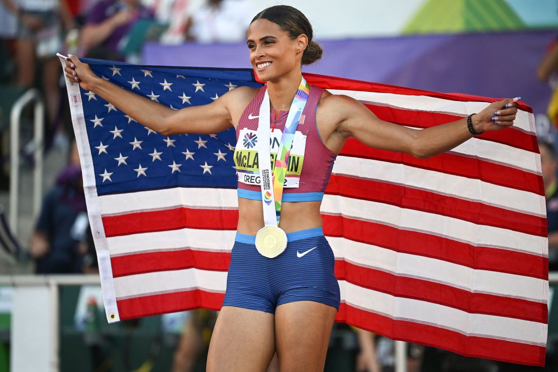 Sydney Mclaughlin celebrates her victory with her gold medal.