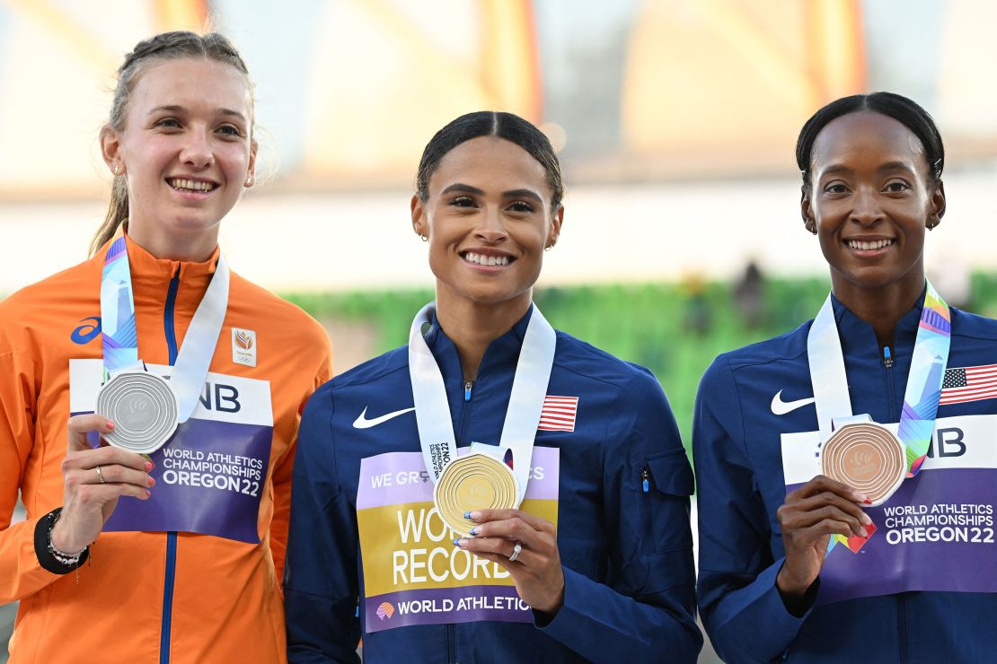 Silver medallist Femke Bol (left), gold medallist Sydney Mclaughlin (center) and bronze medallist Dalilah Muhammad (right) pose during the medal ceremony for the women's 400m hurdles event.