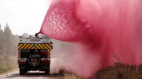 Firefighters spray flame retardant in Hostens, France, on July 22.