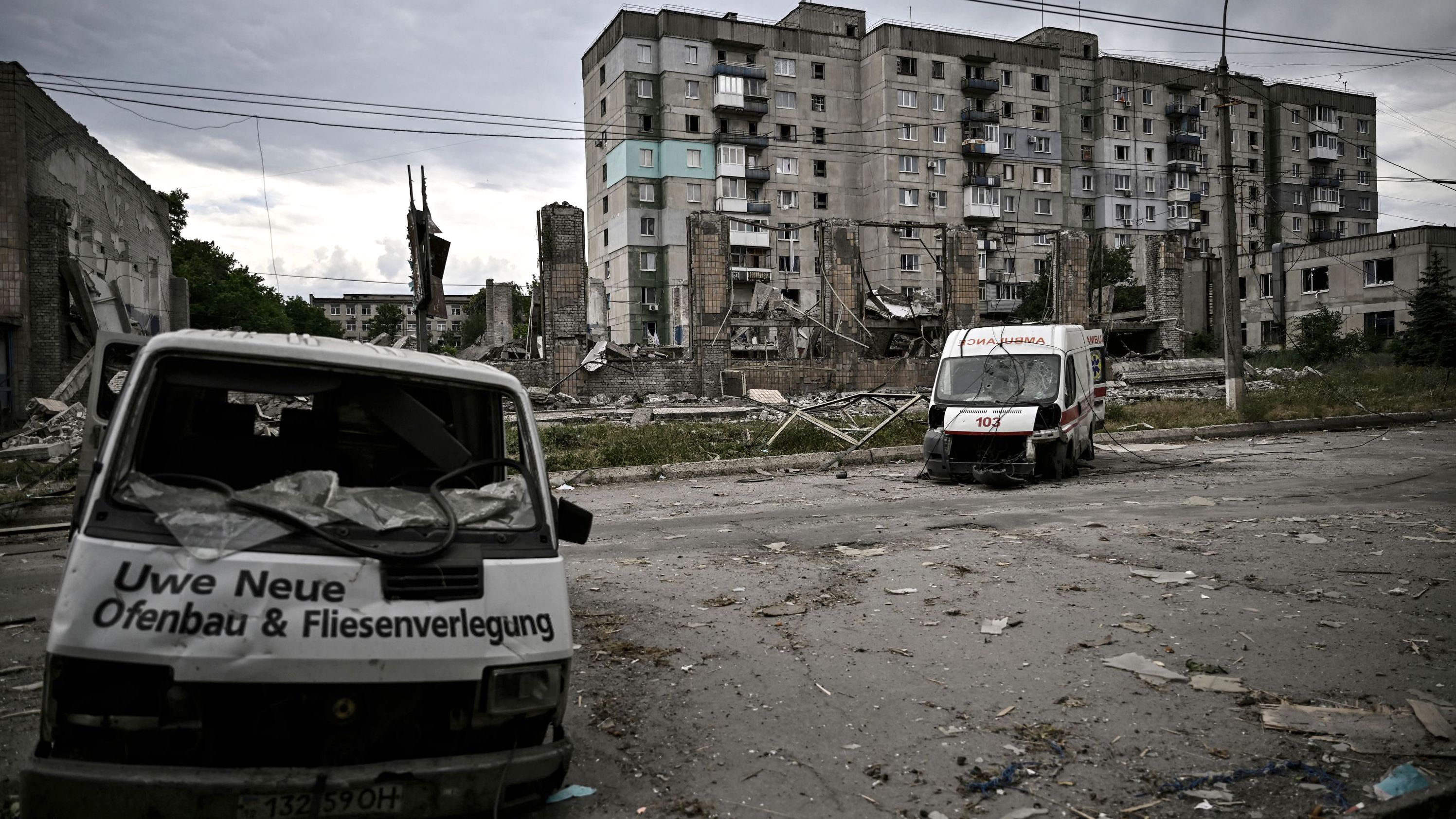 Destroyed vehicles are pictured in the city of Lysychansk in the eastern Ukrainian region of Donbas on June 18, 2022, amid the Russian invasion of the country. 