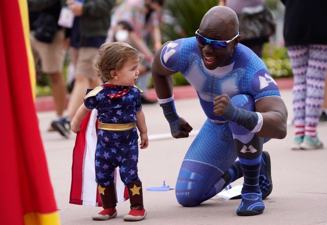 Jay Acey, right, dressed as A-Train from the television series "The Boys," mingles with Maddox Cruz outside the Comic-Con preview night on Wednesday, July 20.