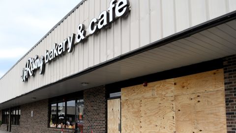 Plywood covers a window and door at UpRising Bakery and Cafe in Lake in the Hills, on July 23, 2022. A family-friendly drag show planned for Saturday was canceled after the vandalism. 