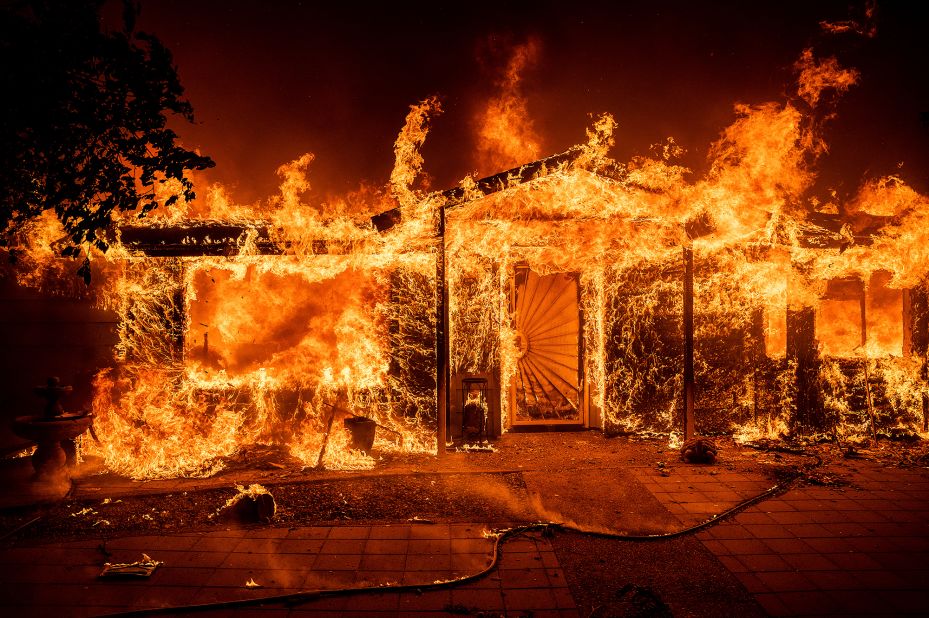Flames consume a home in Mariposa County on Saturday.
