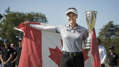 Brooke Henderson of Canada celebrates with the trophy after winning the Evian Championship.