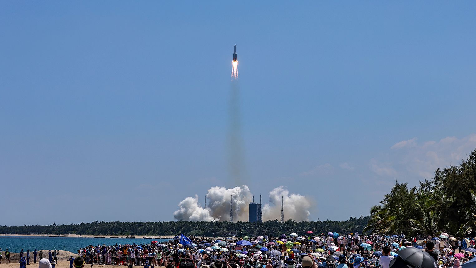 Large crowds of space enthusiasts watching watched China's launch of the Wentian lab module from tropical Hainan Island on a hot Sunday afternoon.