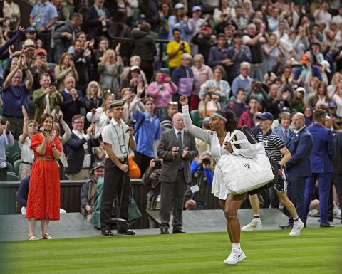 Serena waves to fans after she lost in the first round of Wimbledon in June.