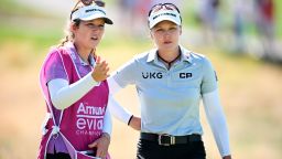  Brooke Henderson (R) looks on with her caddie, and sister, Brittany during the final day of the Evian Championship.
