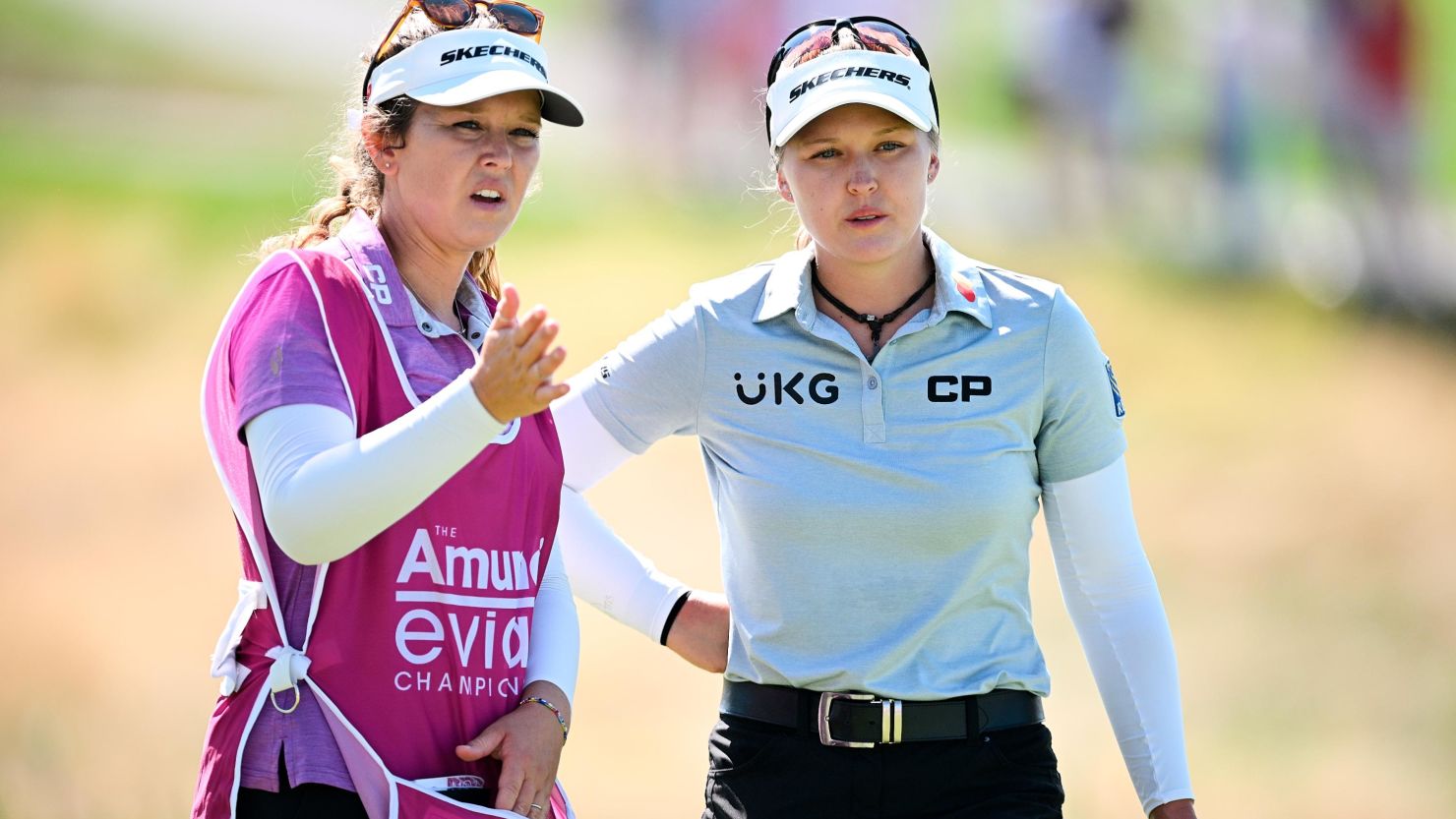  Brooke Henderson (R) looks on with her caddie, and sister, Brittany during the final day of the Evian Championship, on July 24, 2022 in Evian-les-Bains, France. 