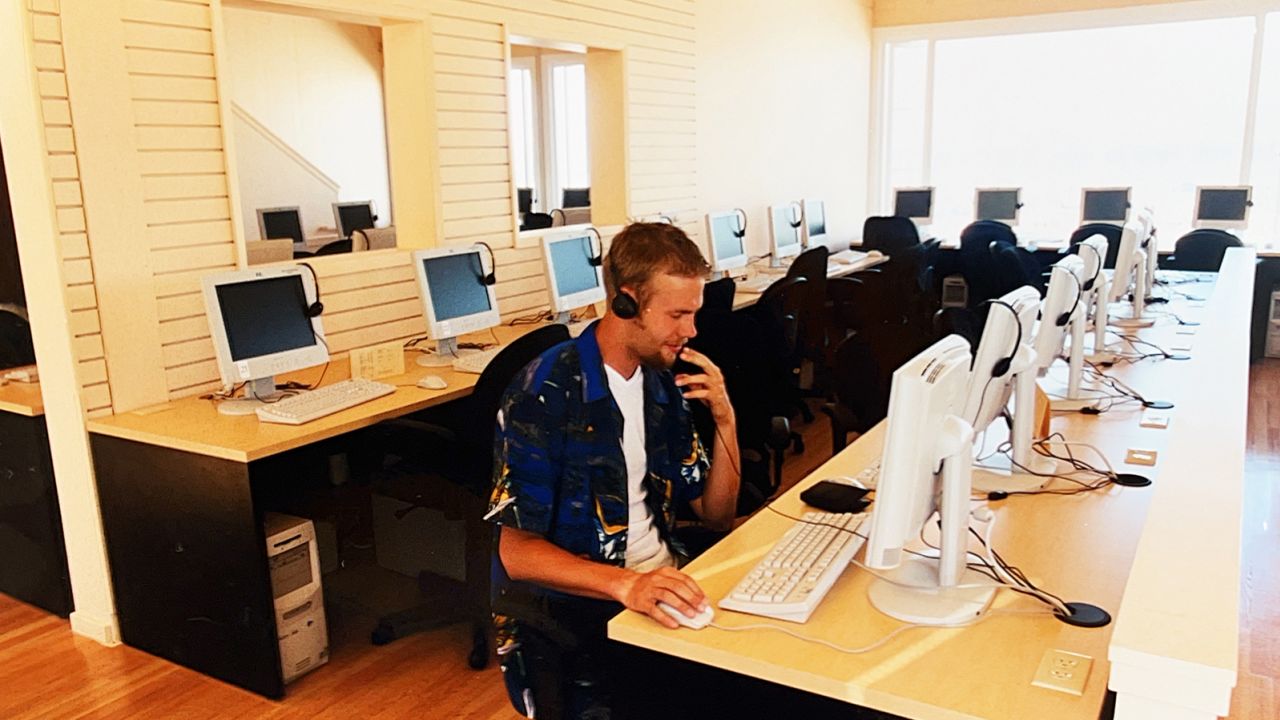 Here's a photo of Kris in a Californian internet cafe reading Carrie's first email.
