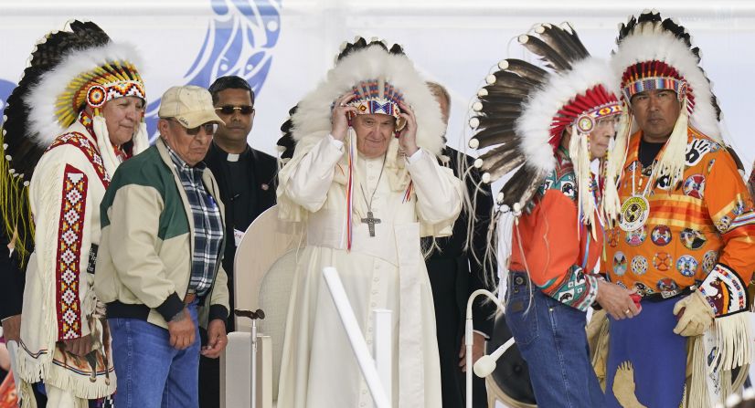 The Pope dons a headdress while visiting with Indigenous people in Maskwacis, Alberta, in July 2022. As he kicked off a weeklong "penitential pilgrimage" to Canada, <a href="index.php?page=&url=https%3A%2F%2Fwww.cnn.com%2F2022%2F07%2F25%2Famericas%2Fpope-francis-canada-speech-intl%2Findex.html" target="_blank">Francis spoke of his "sorrow, indignation and shame"</a> over the Catholic Church's role in the abuse of Canadian Indigenous children in residential schools. He apologized and promised a "serious investigation" into what happened.