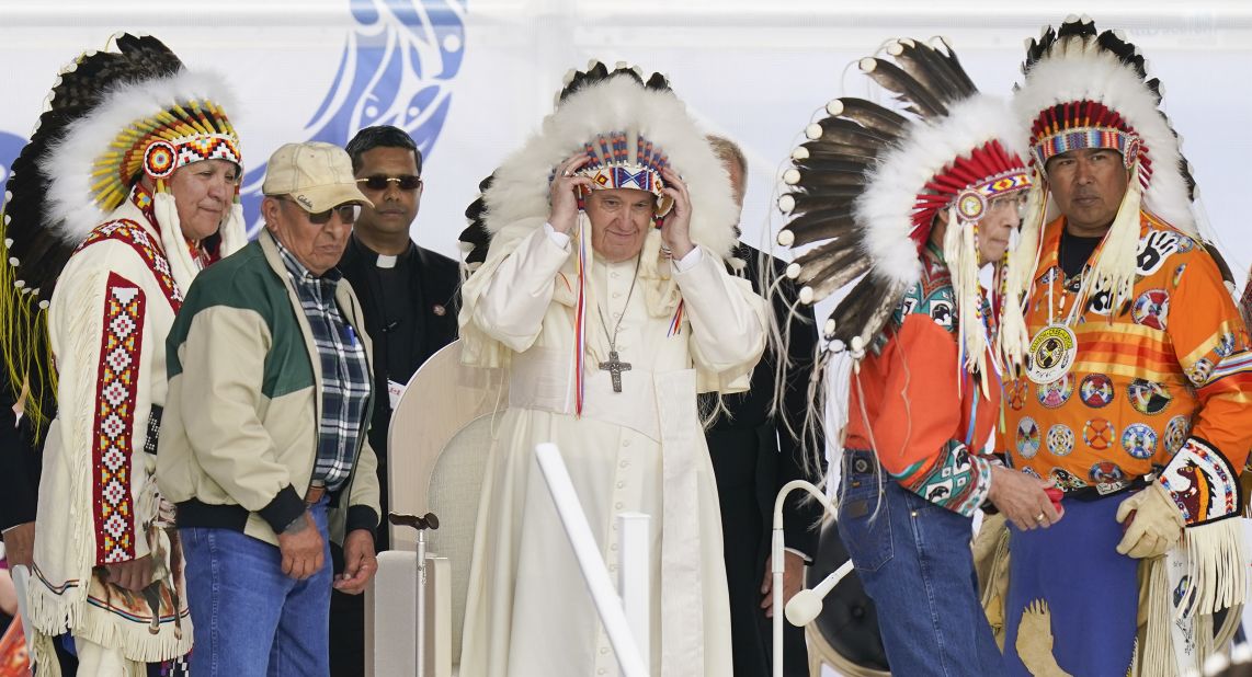 The Pope dons a headdress while visiting with Indigenous people in Maskwacis, Alberta, in July 2022. As he kicked off a weeklong 