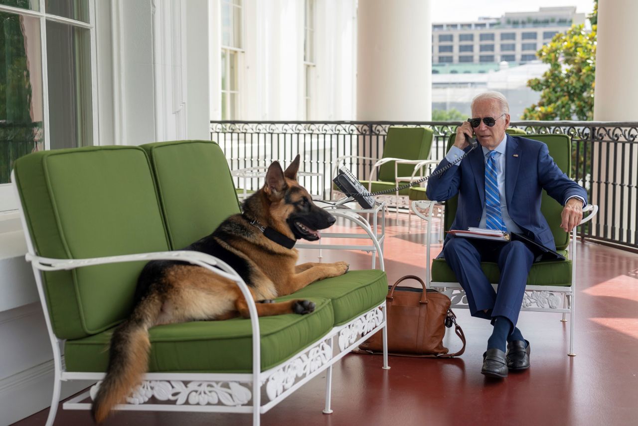 US President Joe Biden works at the White House next to his dog, Commander, while <a href="https://www.cnn.com/2022/07/27/politics/joe-biden-covid-cabin-fever/index.html" target="_blank">he was recovering from Covid-19</a> on Monday, July 25. He's now out of isolation and <a href="https://www.cnn.com/2022/07/27/politics/joe-biden-negative-covid-test/index.html" target="_blank">"feeling great" </a>after testing negative.