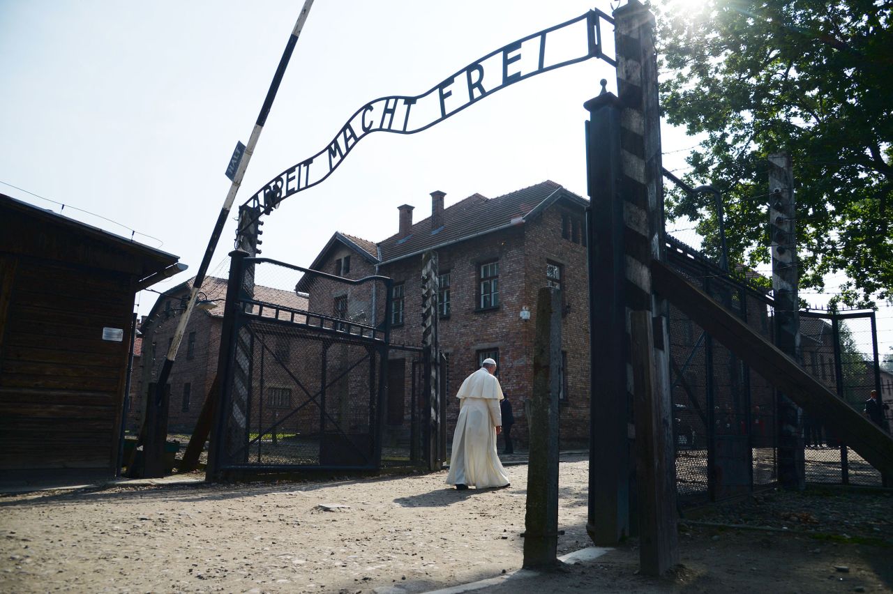 Francis passes the main entrance to Auschwitz-Birkenau, the former concentration camp in Poland, in July 2016. The Pope <a href="http://www.cnn.com/2016/07/29/europe/poland-pope-auschwitz-visit/" target="_blank">was there to pay tribute</a> to those who died in the Holocaust. 